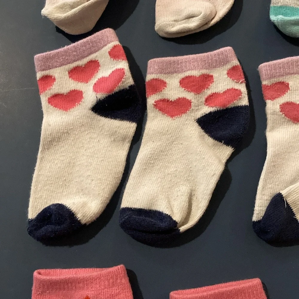 Toddler girl socks clean and washed. 7 pairs or 17 socks. 3 extra socks